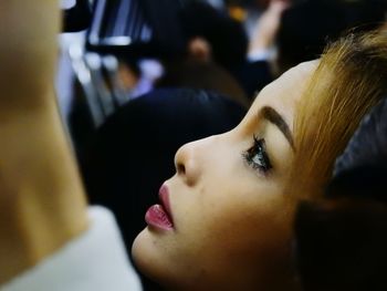 Close-up of young woman in subway train