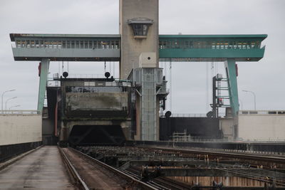 Train on railroad tracks against sky