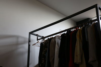 Close-up of clothes hanging on rack