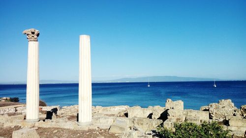 Scenic view of sea against clear blue sky