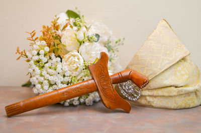 Close-up of white roses on table