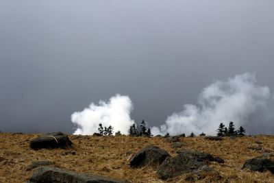 Panoramic view of field against sky
