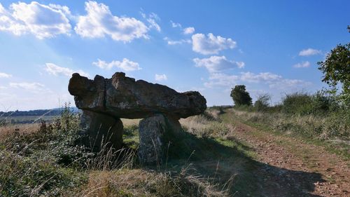 Built structure on landscape against sky