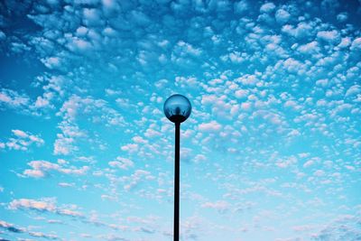 Low angle view of street light against sky