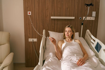 Young woman sleeping on bed at home