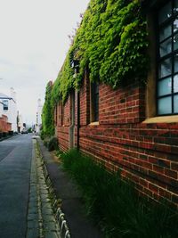 View of road along buildings