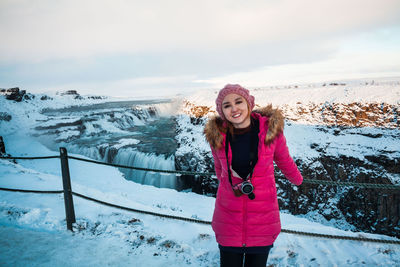 Full length of woman standing in snow