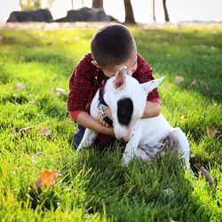 Little girl playing in grassy field