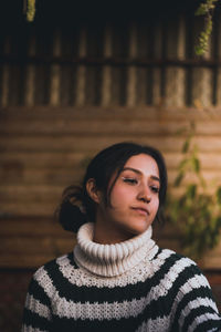 Portrait of a young woman looking away