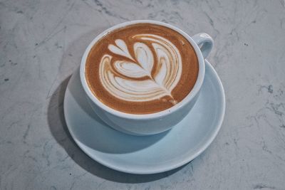 High angle view of cappuccino on table