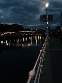 Illuminated building against sky at night