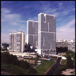 Buildings in city against clear sky