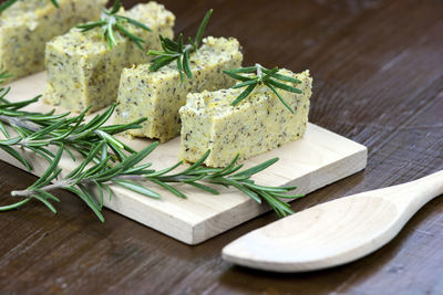 Close-up of sliced baked polenta with rosemary