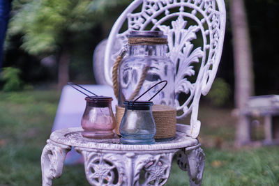 Close-up of drinking glass in jar on table