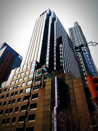 Low angle view of modern buildings against clear sky