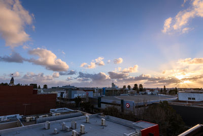 High angle view of buildings against sky during sunset