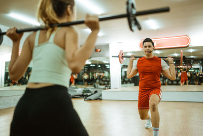 Young woman exercising in gym