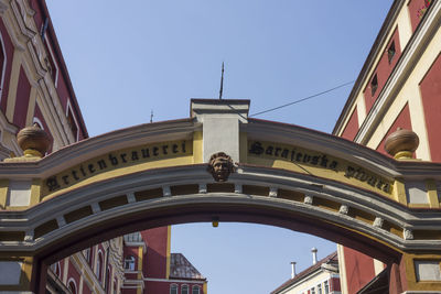 Low angle view of historic building against blue sky