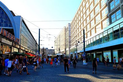 People in city against clear sky