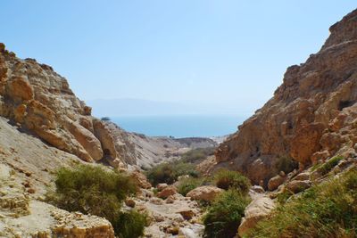 Scenic view of mountains against clear blue sky