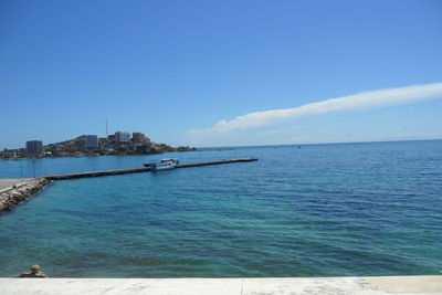 Scenic view of sea against blue sky