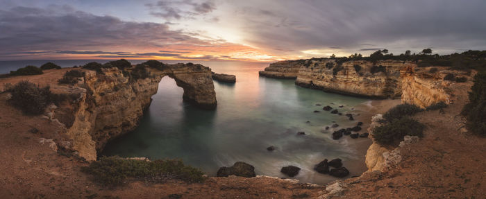 Albandeira beach at sunset in panoramic view