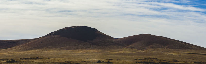 Close-up of sand dunes against sky