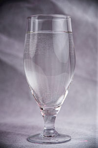 Close-up of beer glass on table