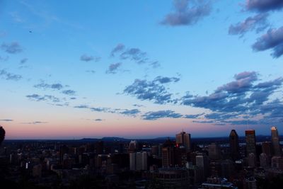 Cityscape against sky at sunset