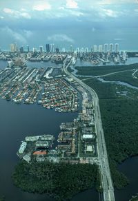 View of cityscape against cloudy sky