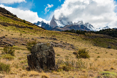 Scenic view of landscape and mountains against sky