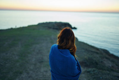 Rear view of woman looking at sea