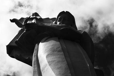 Low angle view of statue against sky