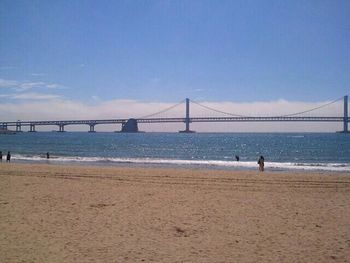 View of suspension bridge on beach