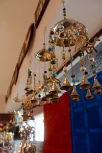 View of metallic decoration hanging at shop for sale