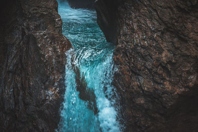 High angle view of rock formation in sea