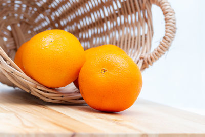 Close-up of orange fruits in basket