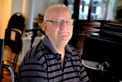 Portrait of man sitting at home