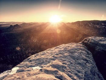 Scenic view of mountains against sky during sunset