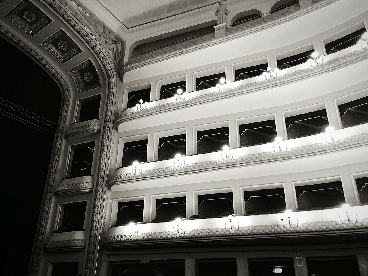 architecture, built structure, low angle view, window, building exterior, building, repetition, full frame, balcony, indoors, staircase, architectural feature, no people, railing, pattern, residential structure, day, residential building, old, in a row