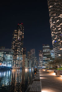 Illuminated buildings in city at night