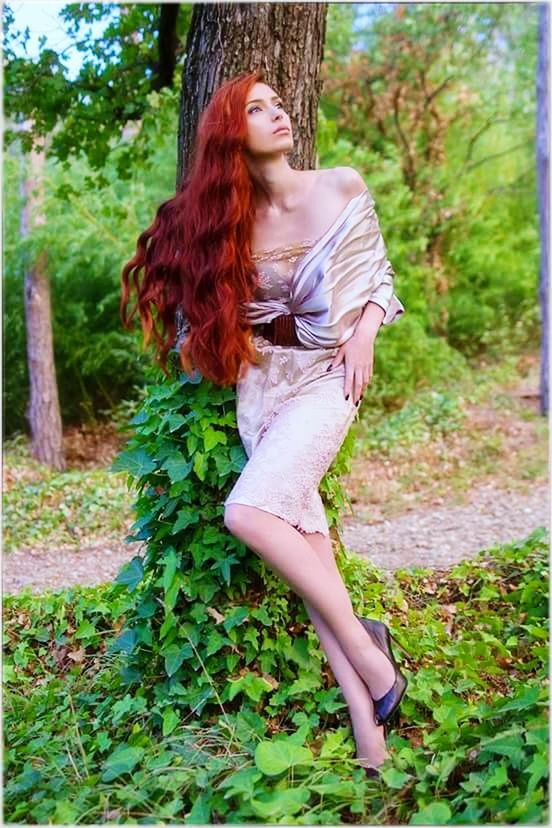 tree, young adult, lifestyles, casual clothing, young women, person, grass, full length, leisure activity, tree trunk, front view, focus on foreground, long hair, standing, dress, forest, day