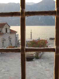 View of balcony against sky seen through window