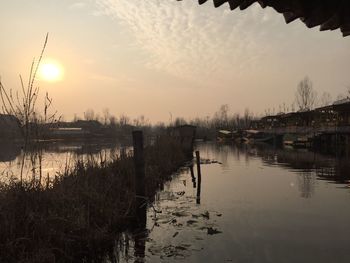 Scenic view of lake against sky during sunset