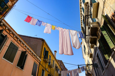 Typical city corner with ancient colorful buildings drying clothes on a clothes-line in outdoor 