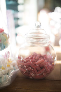 Close-up of ice cream in glass jar on table