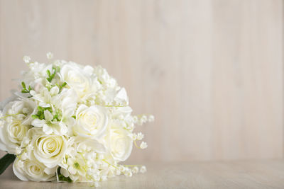 Close-up of white rose on table