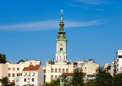 Low angle view of buildings against blue sky