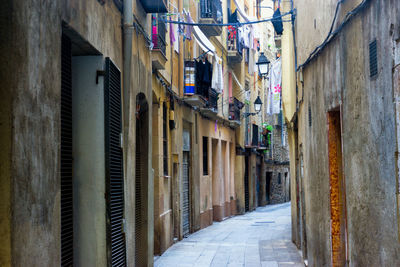 Narrow alley amidst buildings in city