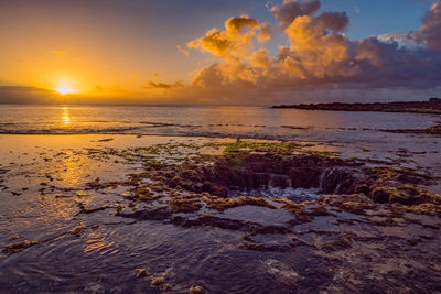 Scenic view of sea against sky during sunset